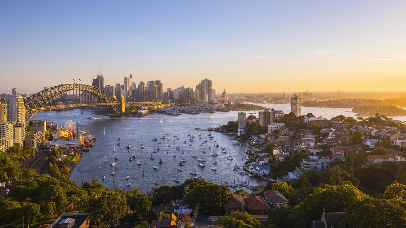 View of sun setting over Sydney Harbour from Harbourview Hotel, North Sydney. Image credit: Destination NSW