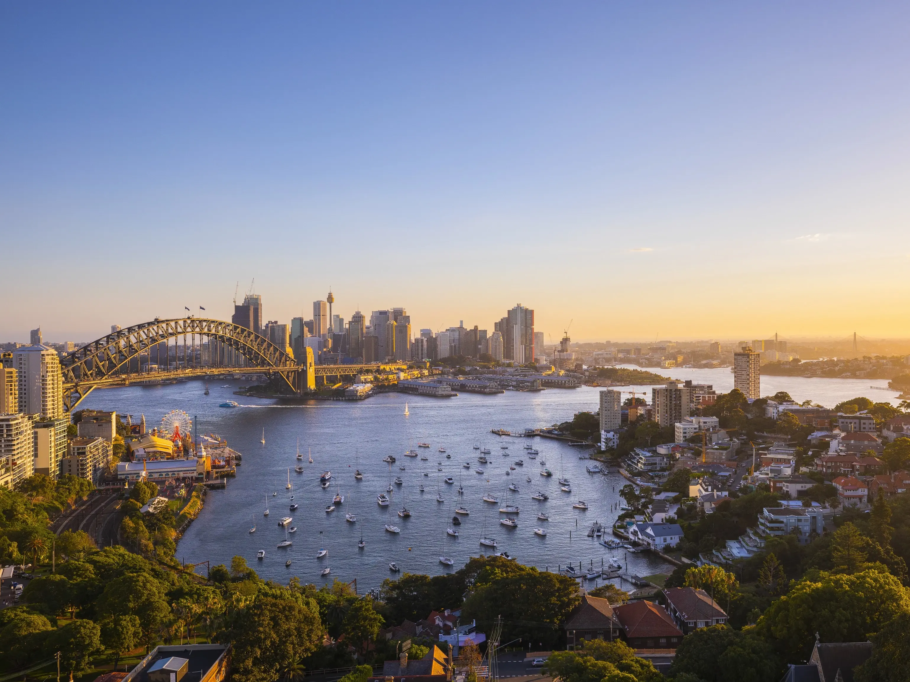 View of sun setting over Sydney Harbour from Harbourview Hotel, North Sydney. Image credit: Destination NSW
