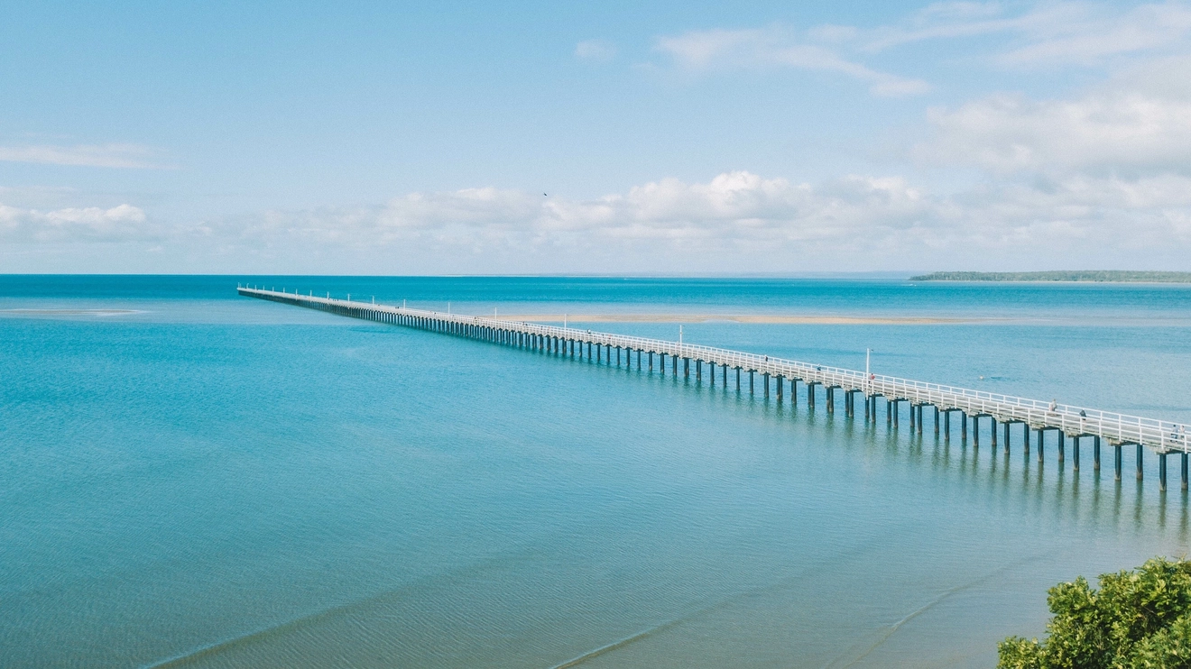 Stroll out to sea along Hervey Bay's Urangan Pier. Image credit: stock.adobe.com