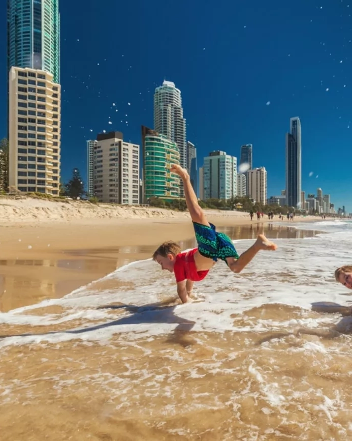 Two boys playing at the beach side. Image credit: Shutterstock