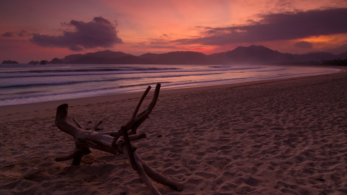 A calm view of Red Beach, Banyuwangi during sunset, Indonesia. Image credit: stock.adobe.com