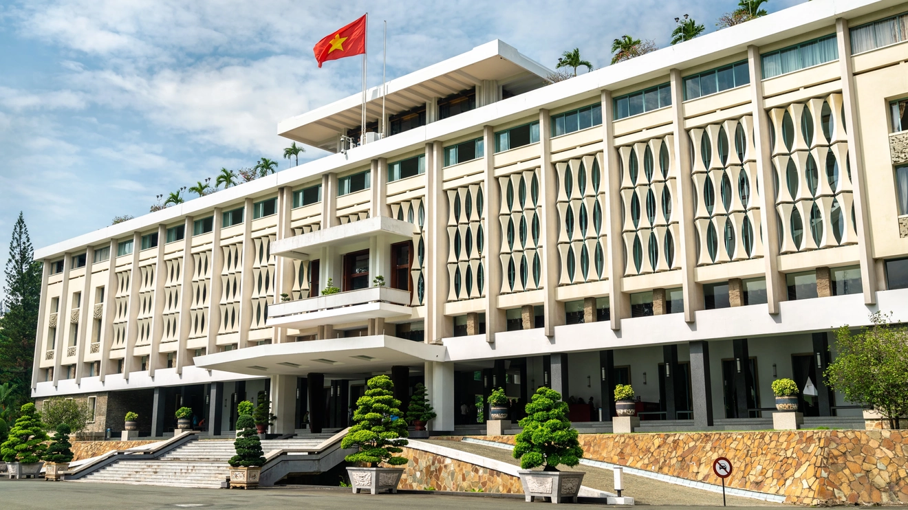 The grand, 1960s exterior of the Independence Palace, Ho Chi Minh City, Vietnam. Image credit: stock.adobe.com
