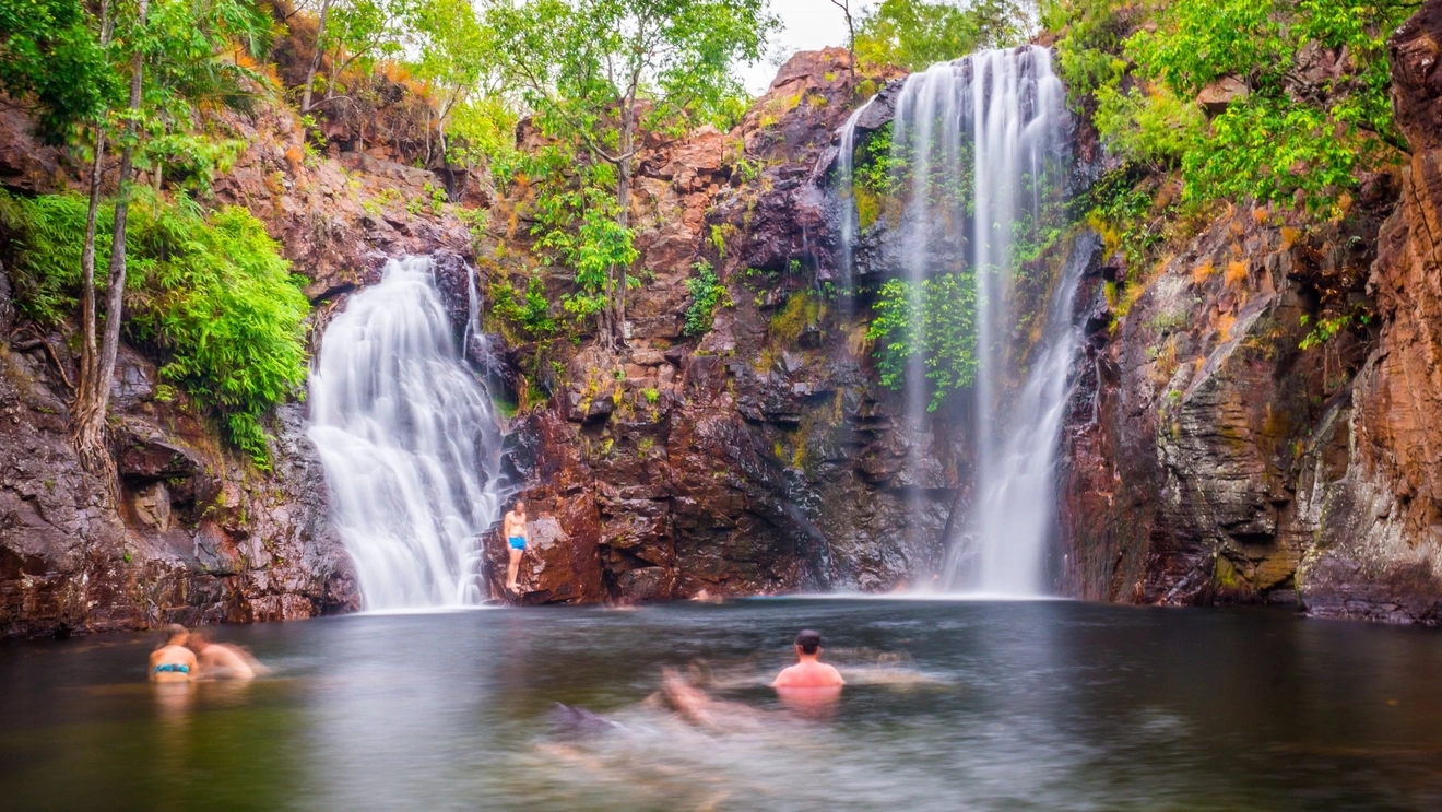 People swimming at Florence Falls swimming hole in Litchfield National Park. Image credit: Shutterstock