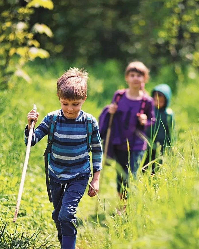 Kids trek through the wilderness in Hobart, Tasmania.