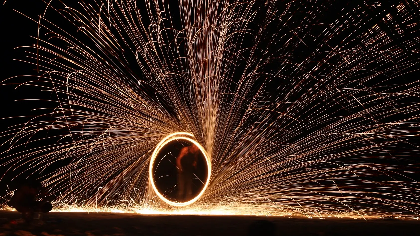 Sparks fly as a fire-dancer performs a traditional dance in Port Vila, Vanuatu. Image credit: stock.adobe.com