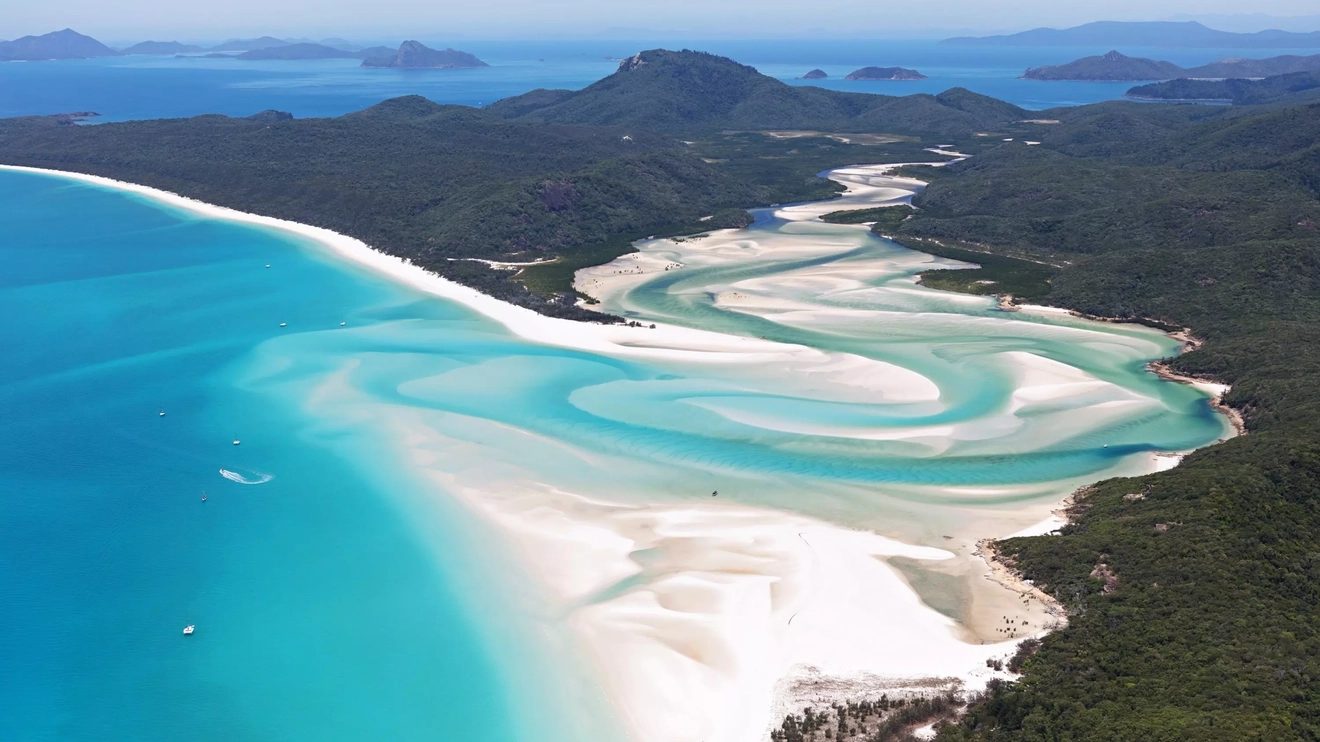 An aerial shot of the white sand and turquoise waters of Whitehaven Beach, Whitsunday Coast, Queensland.