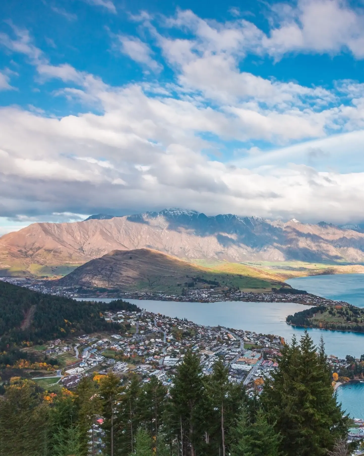 Aerial daytime view of Queenstown, with viewing platform in the foreground. Image credit: stock.adobe.com