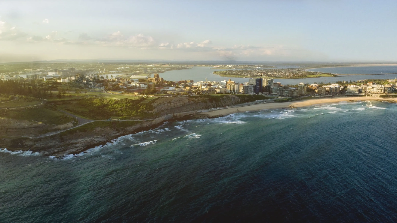 Aerial view of Newcastle coastline, skyline and Newcastle Beach. Image credit: Destination NSW
