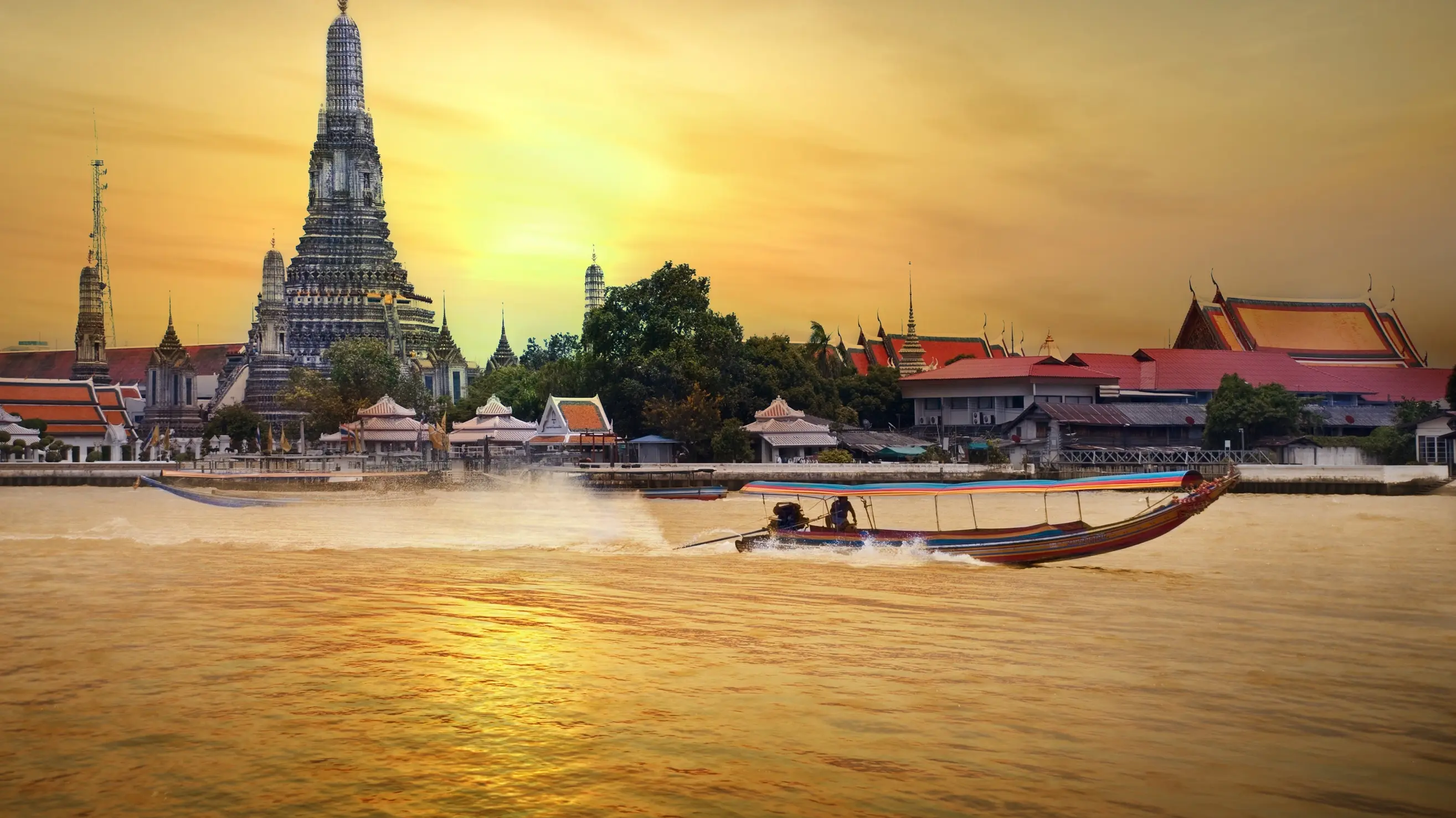 Longtail boat on Chao Phraya River, Bangkok, at sunset. Image credit: Shutterstock