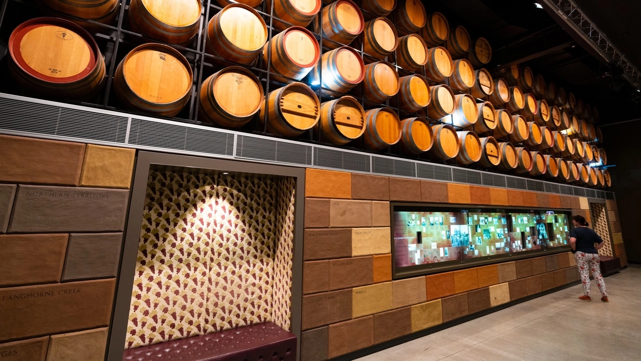 Interior view of the National Wine Centre of Australia with wine barrels display and tourist, Adelaide, South Australia.