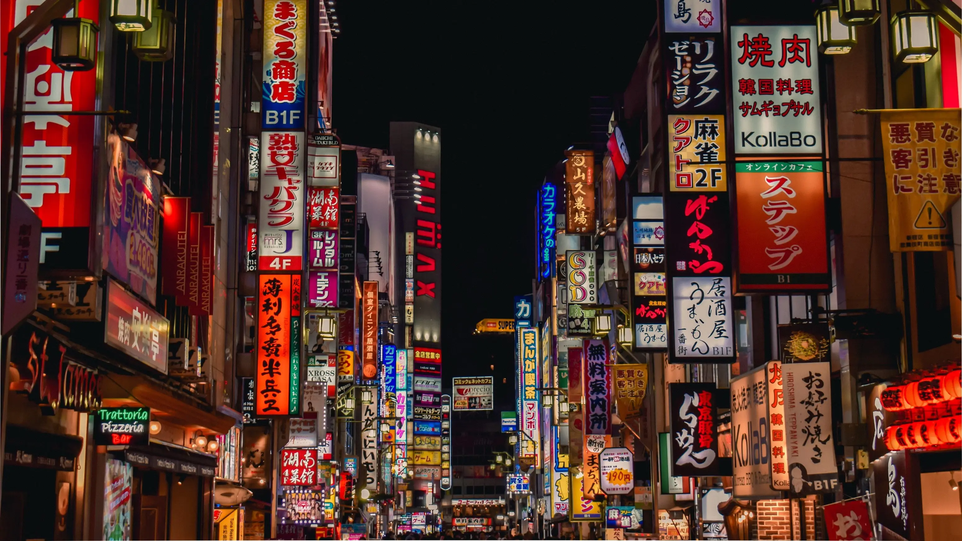 Laneway at night in Shinjuku with illimunated neon billboards in Japanese. Image credit: stock.adobe.com