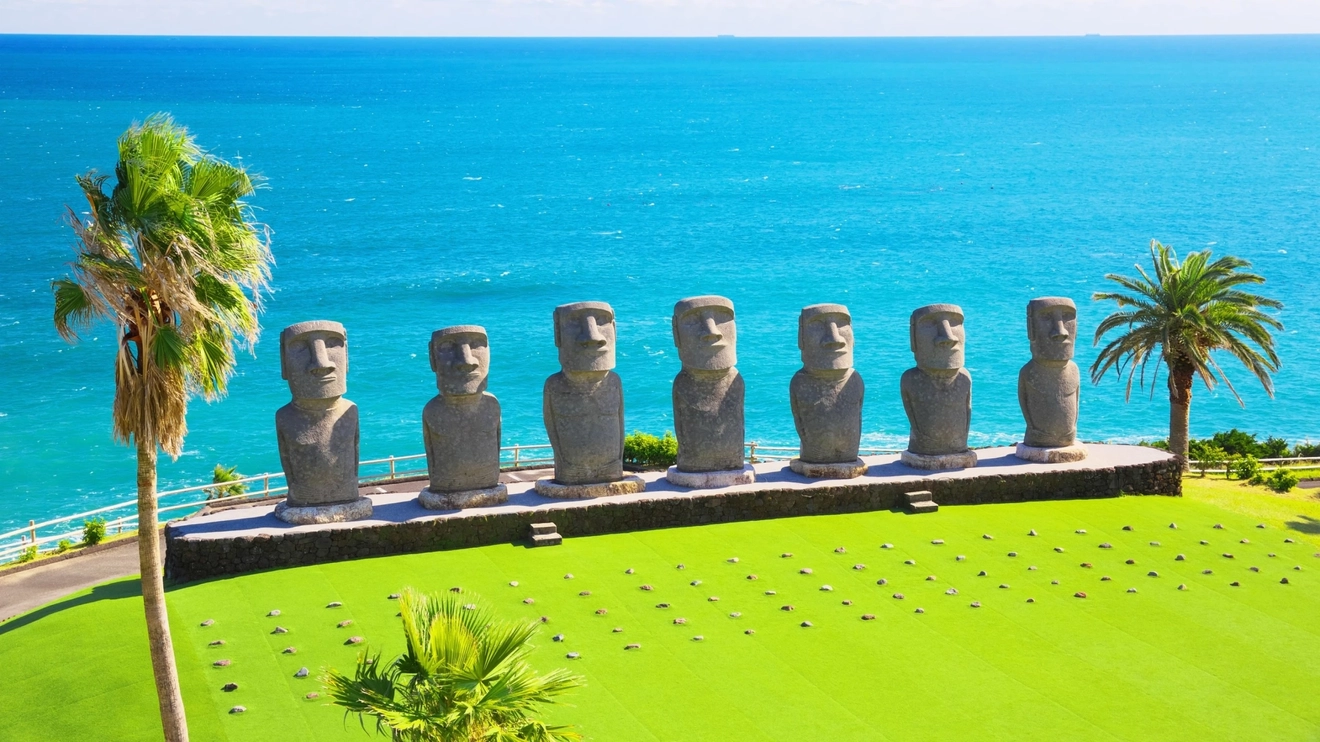 Moai statues with Pacific Ocean in background at Sun Messe Nichinan, Miyazaki, Japan. Image credit: stock.adobe.com