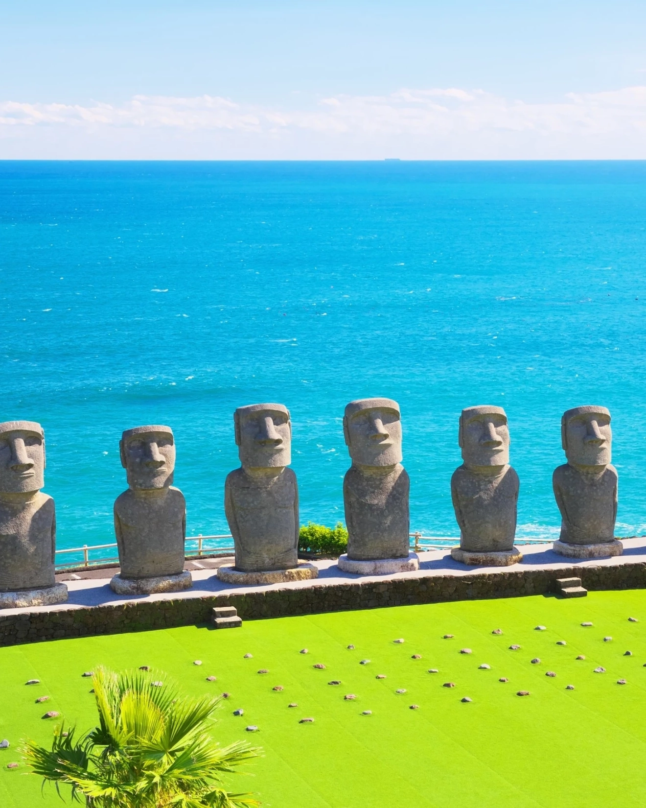 Moai statues with Pacific Ocean in background at Sun Messe Nichinan, Miyazaki, Japan. Image credit: stock.adobe.com