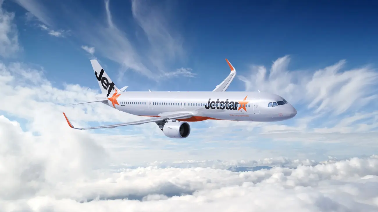 A Jetstar A321LR (NEO) aeroplane flying in blue sky with white clouds. Image credit: Jetstar