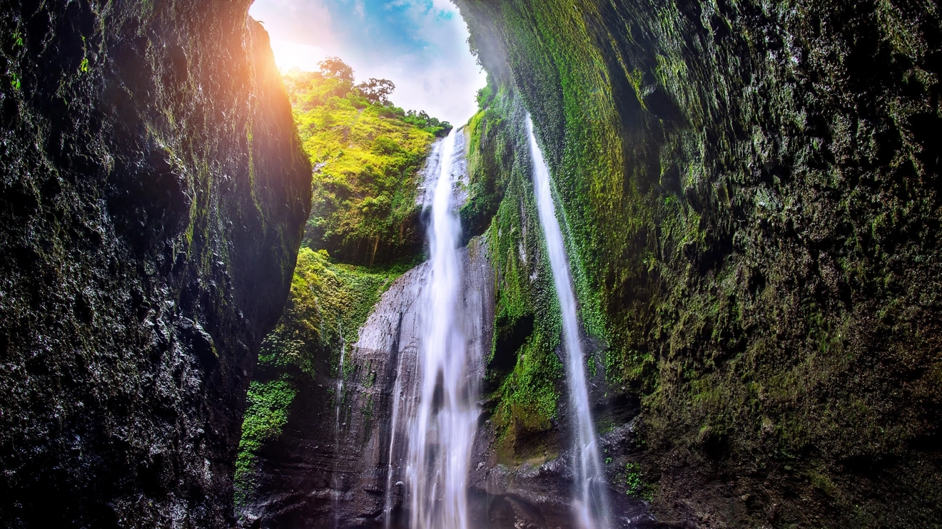 The Madakaripura Waterfall of Surabaya, Indonesia, surrounded by lush greenery. Image credit: stock.adobe.com