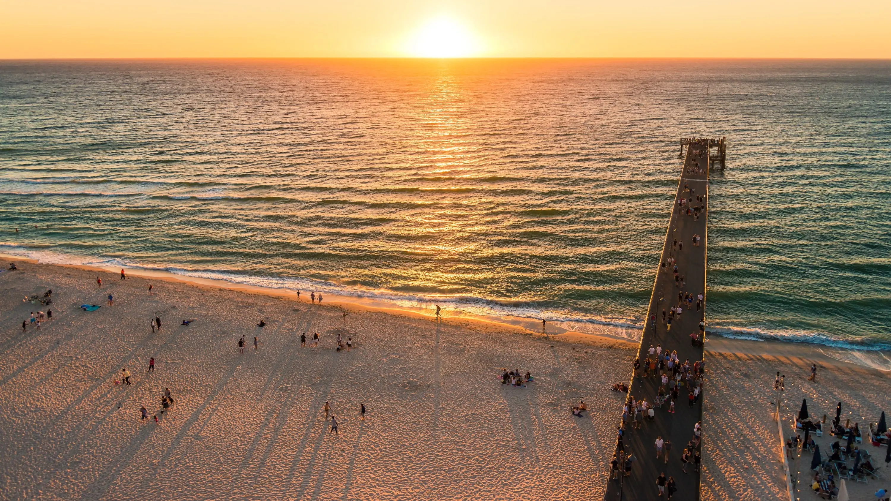 Aerial view of Glenelg Beach and jetty at sunset. Image credit: stock.adobe.com