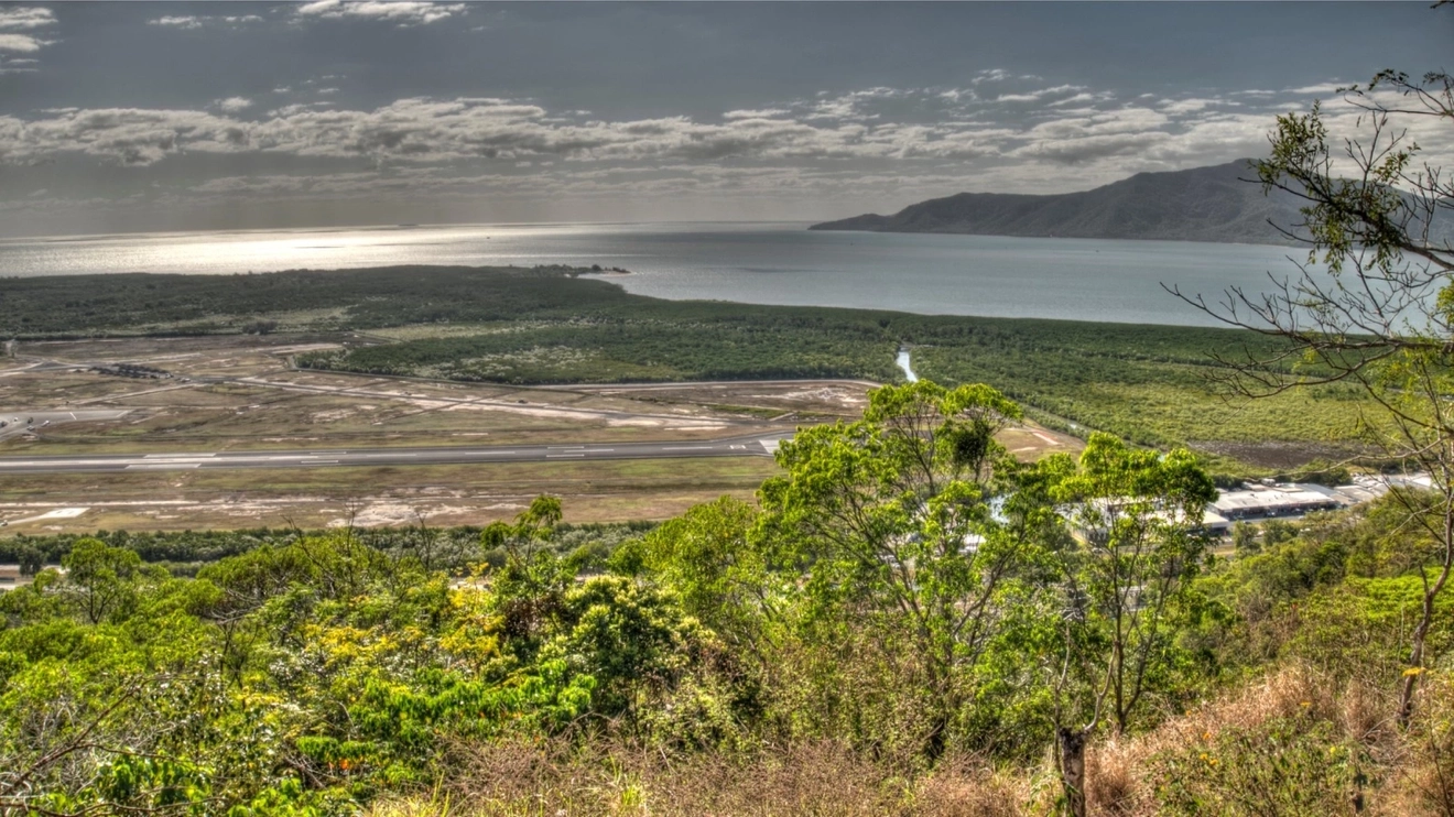 A view of Cairns airport runway and Coral Sea from Mount Whitfield, Tropical North Queensland.