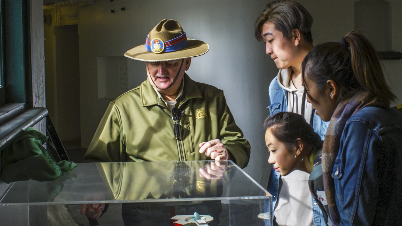 Group enjoying a guided tour with a Fort Scratchley Historical Society volunteer at Fort Scratchley, Newcastle. Image credit: Destination NSW/Eluminate Media