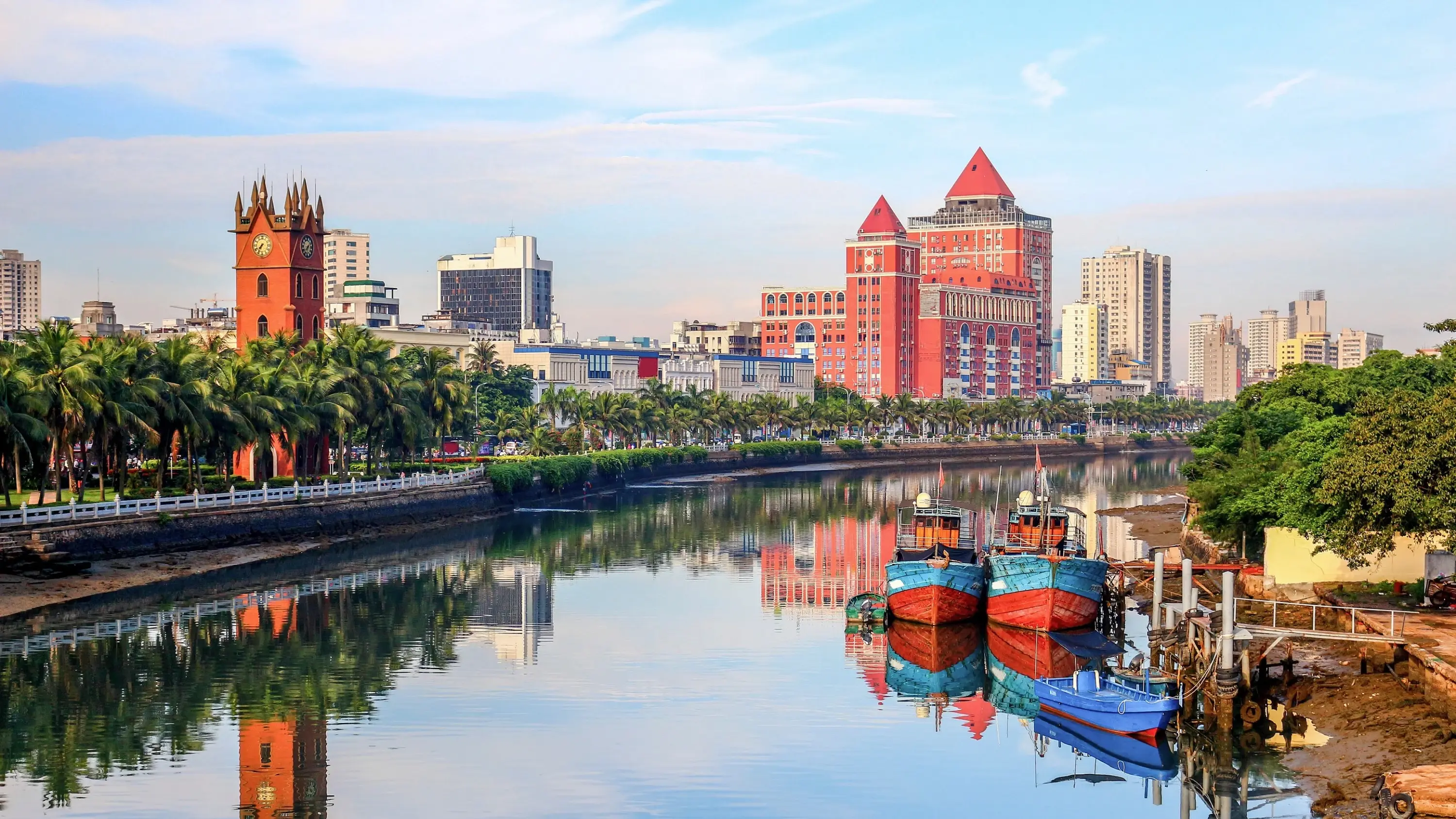 Haikou city skyline with river in foreground. Image credit: stock.adobe.com