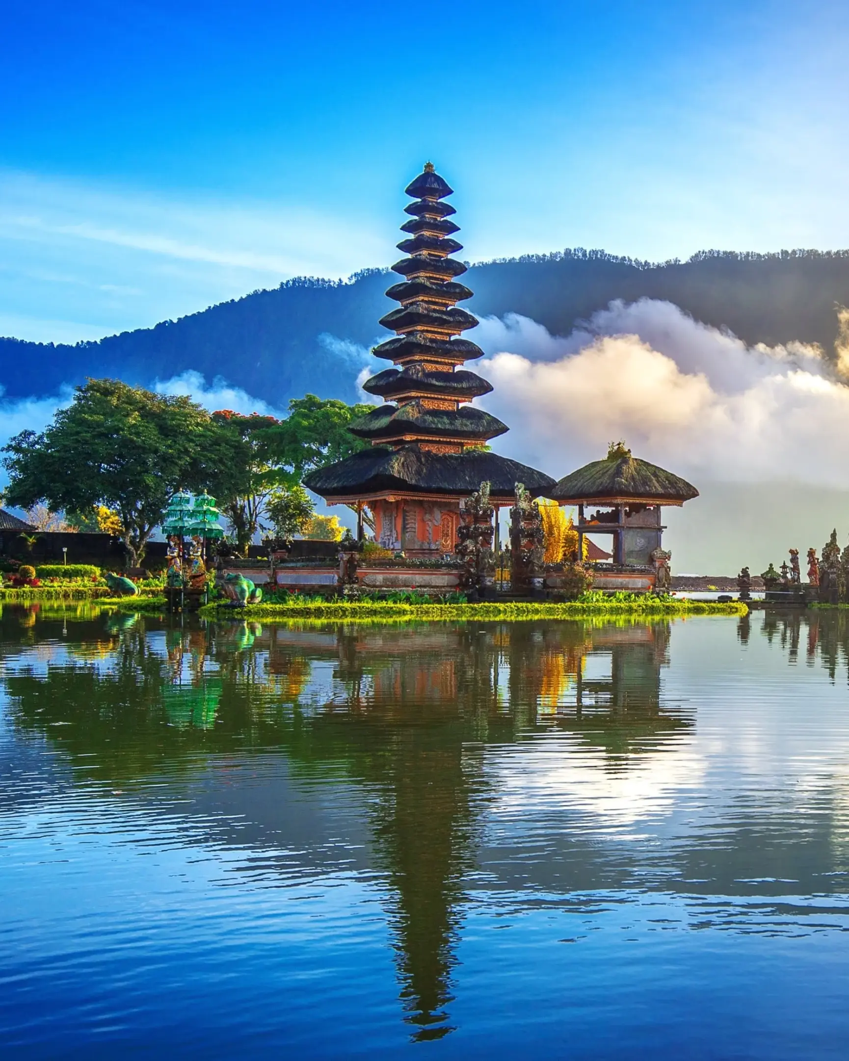 Pura Ulun Danu Bratan, a Hindu temple on a lake with mountain and clouds in the background, in Bali, Indonesia. Image credit: stock.adobe.com