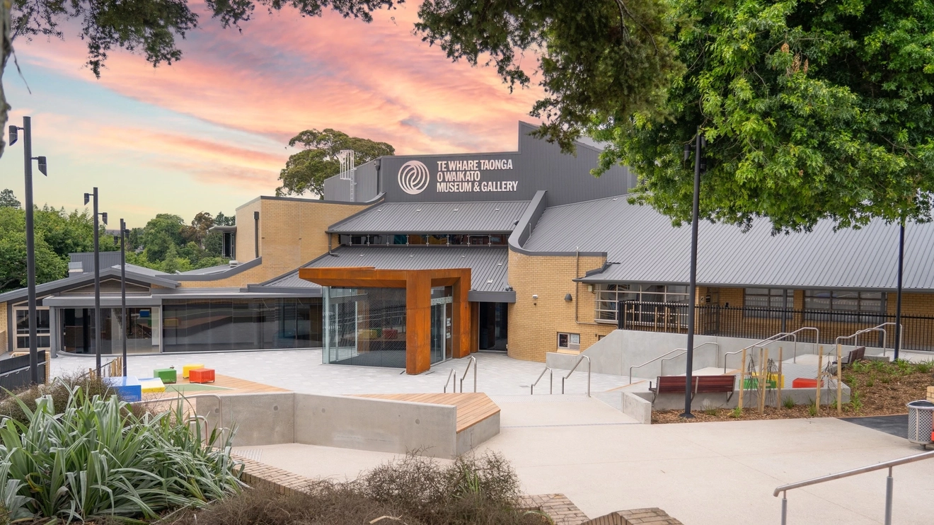 Facade of the renovated Te Whare Taonga O Waikato Museum and Gallery, with pink clouds in background, Hamilton, New Zealand. Image credit: Te Whare Taonga O Waikato Museum &amp; Gallery