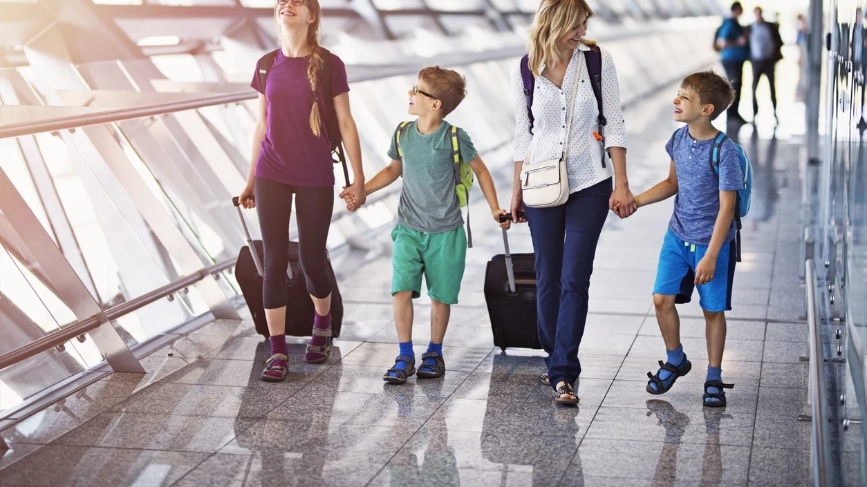 Family walking through the airport