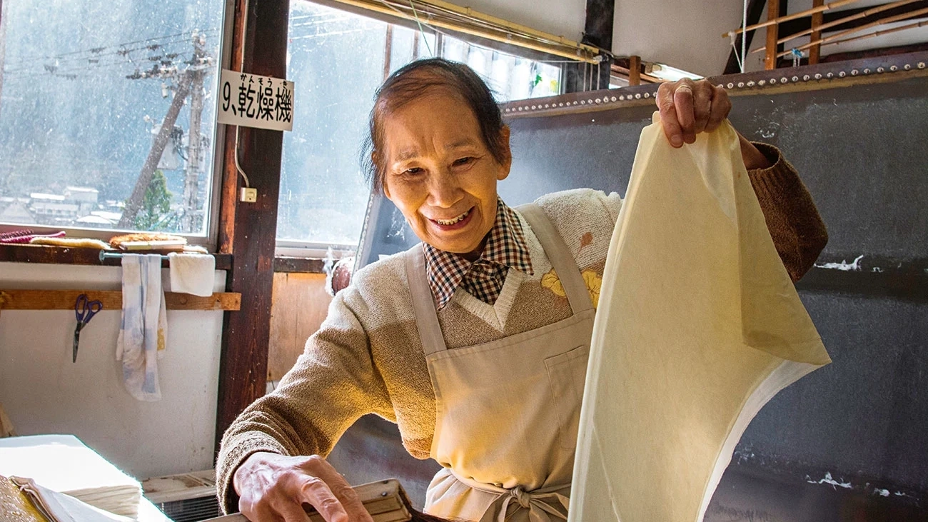 A Japanese woman making paper