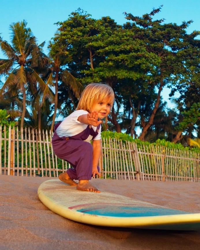 Child learning to surf 