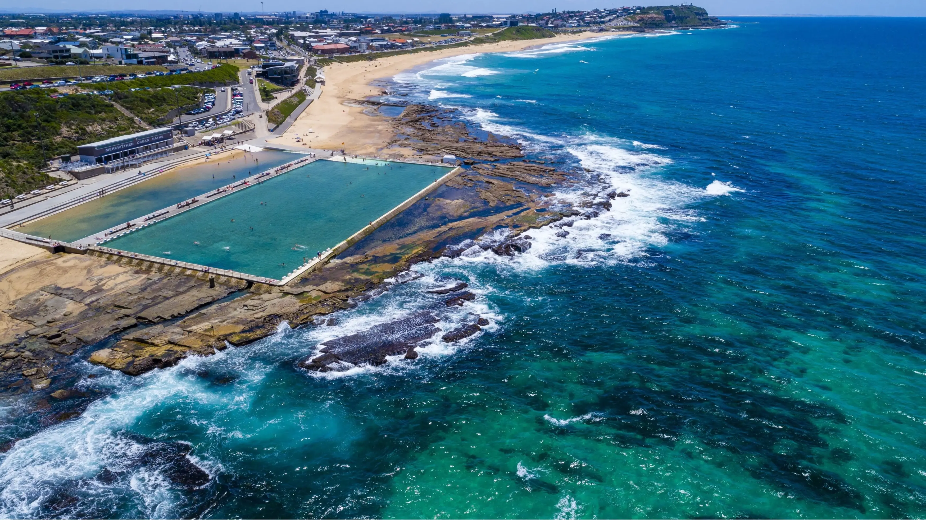 Aerial view of Merewether Ocean Baths on the Newcastle Coast. Image credit: Destination NSW
