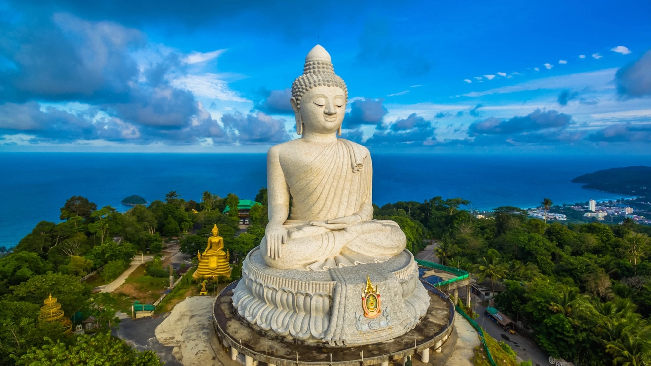 Aerial view of Phuket’s Big Buddha, with blue sky and sea in background. Image credit: stock.adobe.com