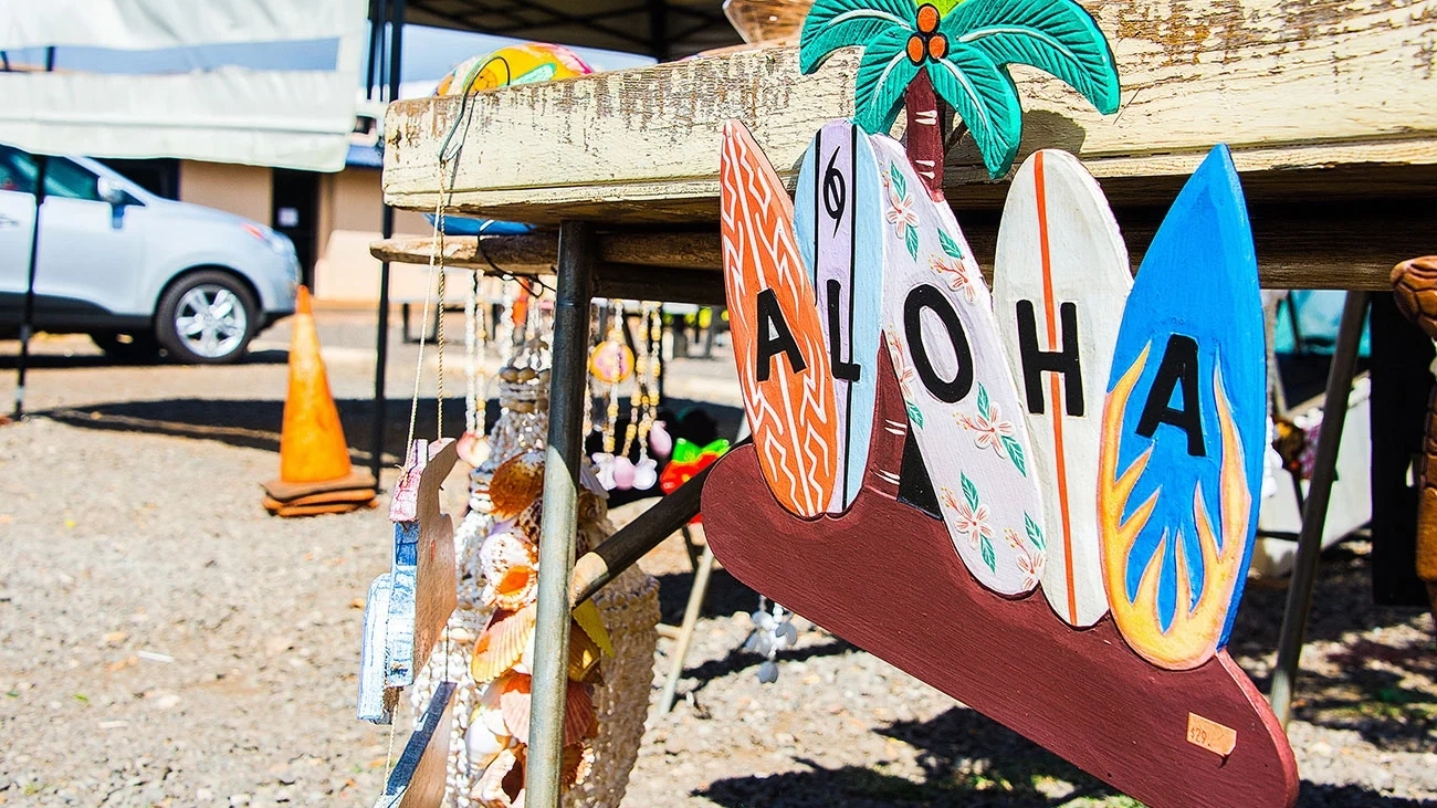 An artwork made of of surfboards painted with the word 'aloha