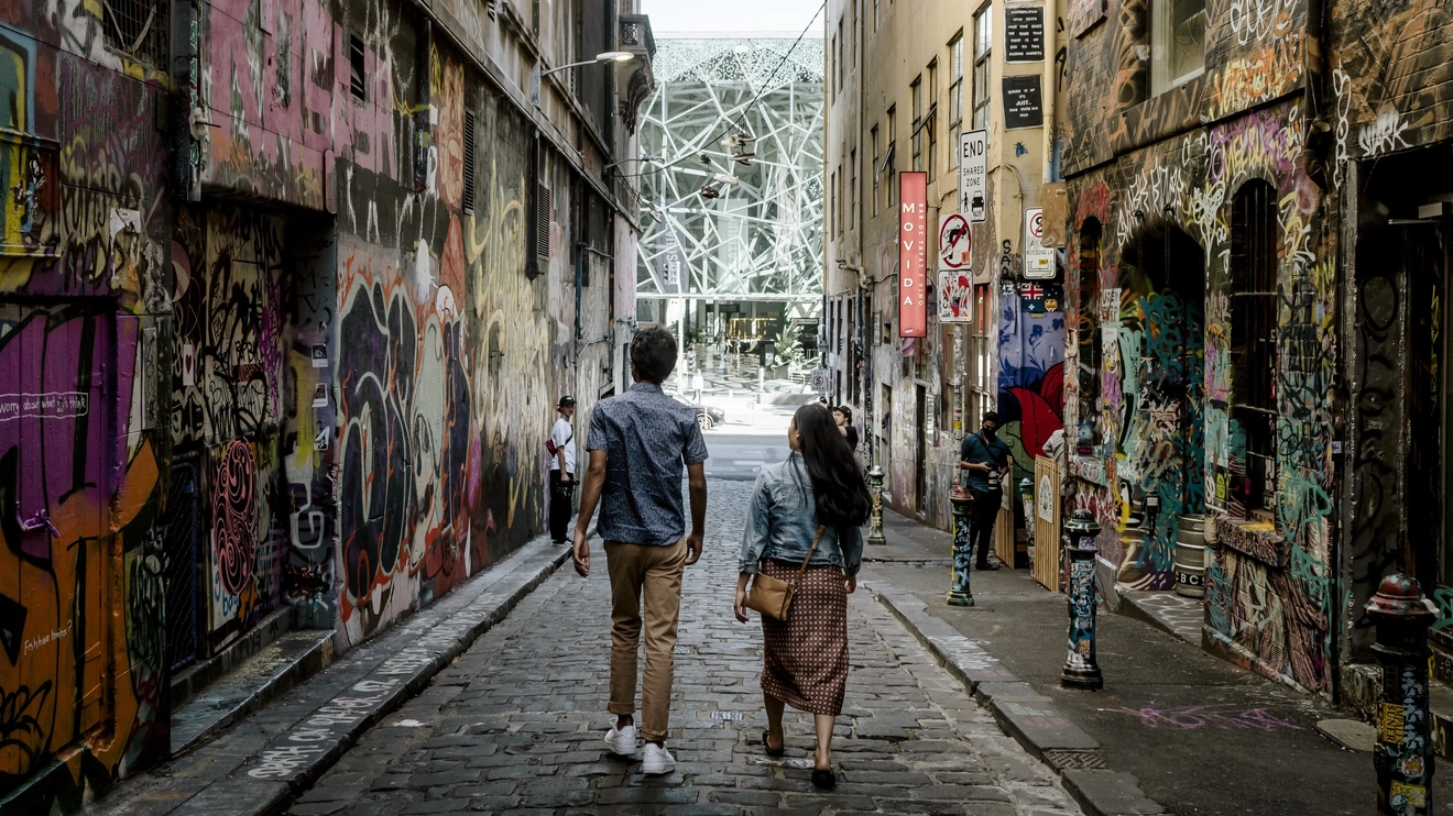 Couple looking at street art in Melbourne's Hosier Lane. Image credit: Visit Victoria