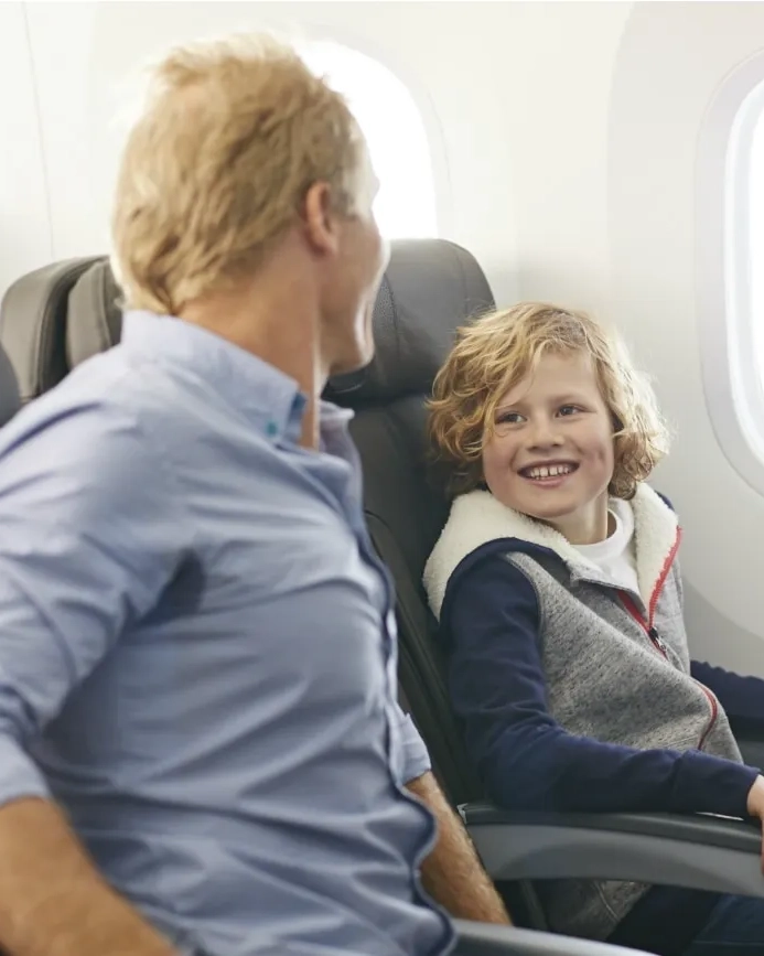 Father and son on an airplane.