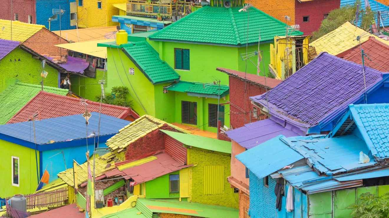 A view of the multicolored homes and buildings in Jodipan, the Rainbow Village of Surabaya, Indonesia. Image credit: stock.adobe.com