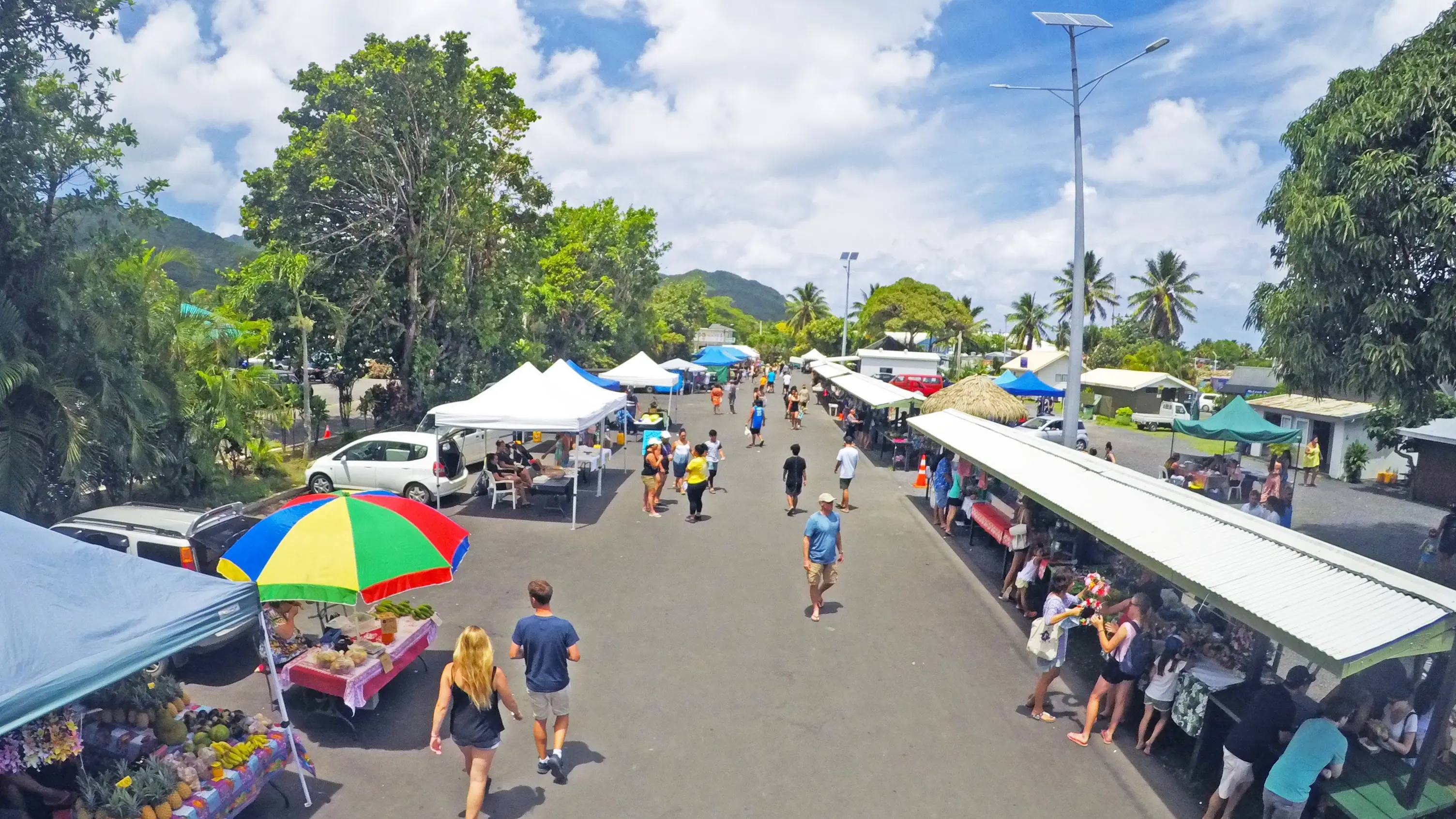 Aerial view of people and stalls at Punanga Nui Market, Rarotonga. Image credit: stock.adobe.com