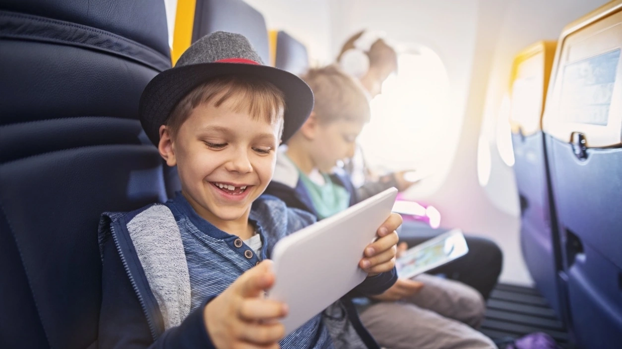 Kids are playing with their IPad. Image credit: iStock