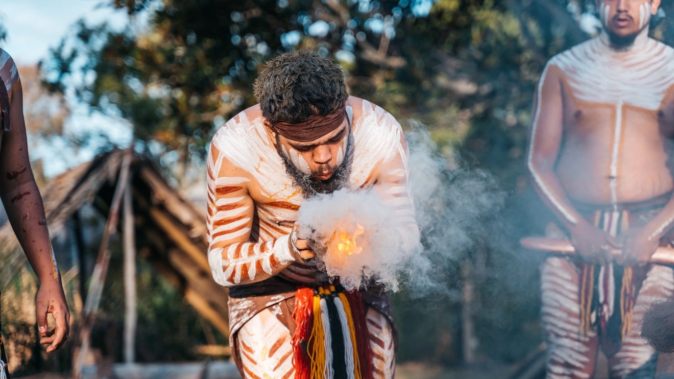 Traditional Aboriginal smoking ceremony at Spirits of the Red Sand. Image credit: Tourism and Events Queensland
