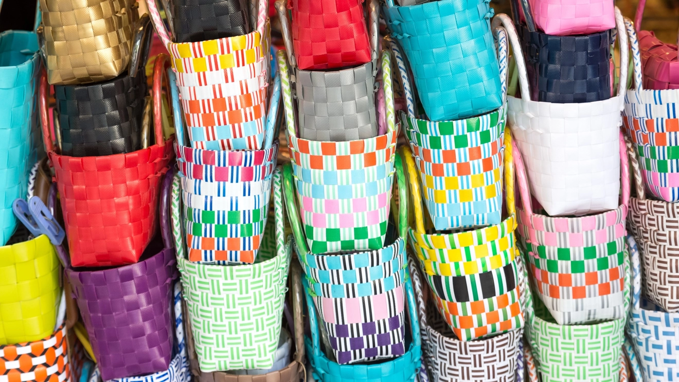 Brightly coloured woven baskets at a market stall in Ho Chi Minh City, Vietnam. Image credit: stock.adobe.com