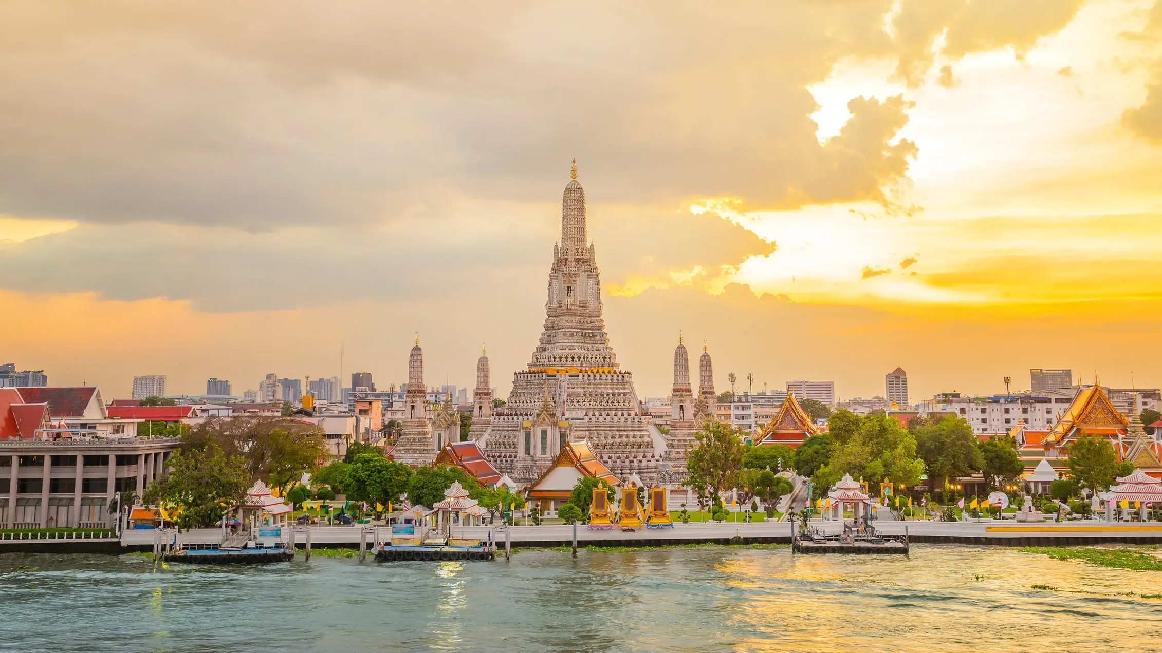 Wat Arun at sunset, with the Chao Phraya River in the foreground, Bangkok, Thailand. Image credit: stock.adobe.com