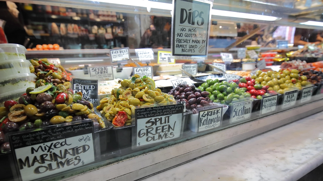A mouth-watering array of olives, displayed at a stall in Melbourne's Queen Victoria Market. Image credit: stock.adobe.com