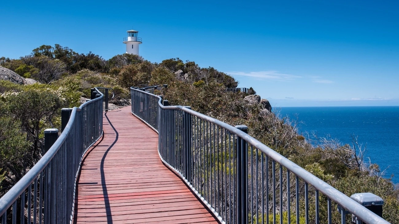 A boardwalk leads along the coast to Cape Tourville lighthouse.