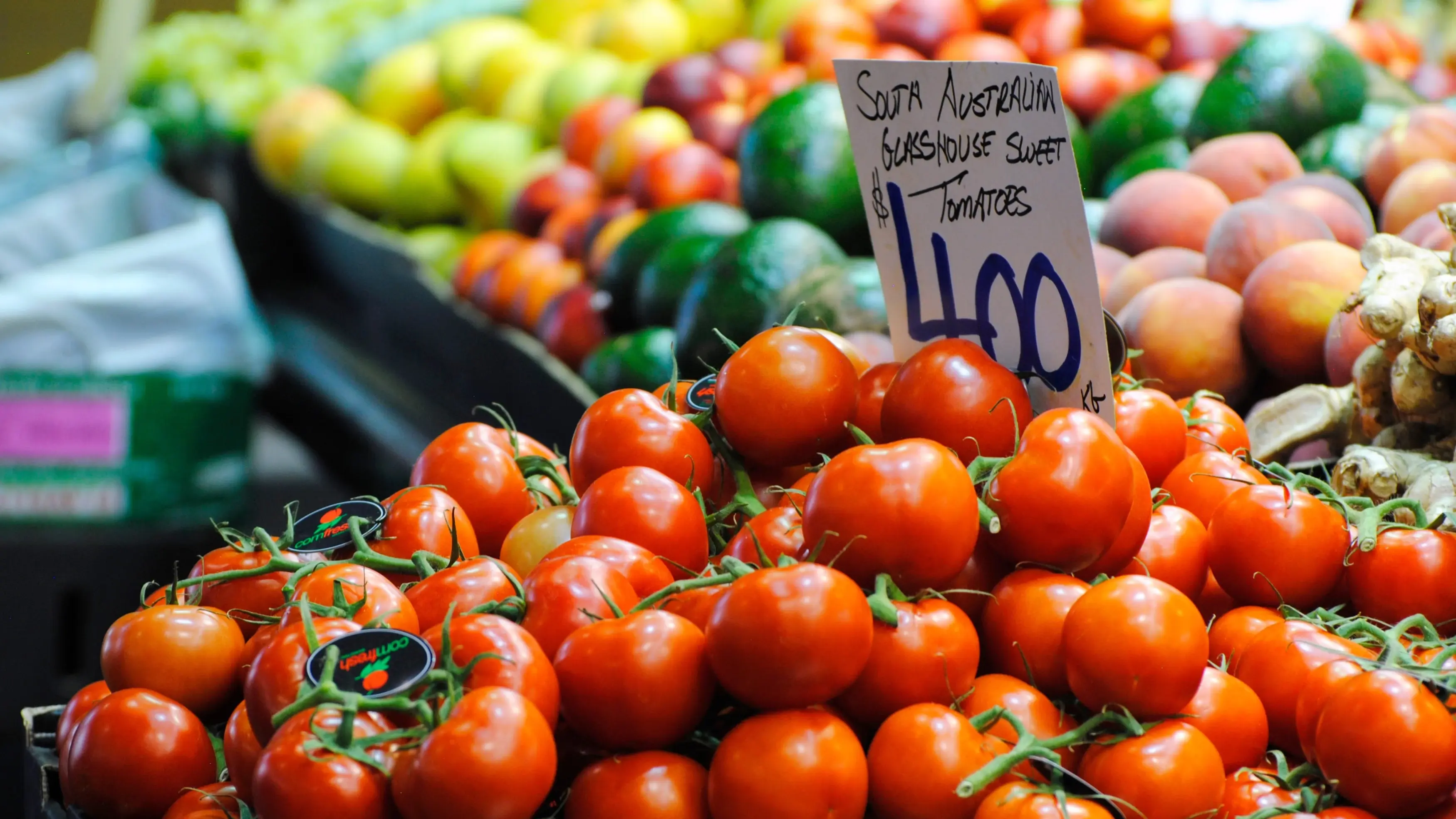 A market stall piled high with South Australian Glasshouse sweet tomatoes. Image credit: stock.adobe.com