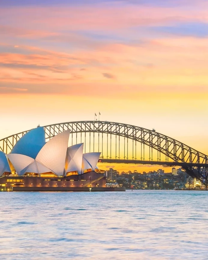 Sydney Opera house and harbour bridge at sunset
