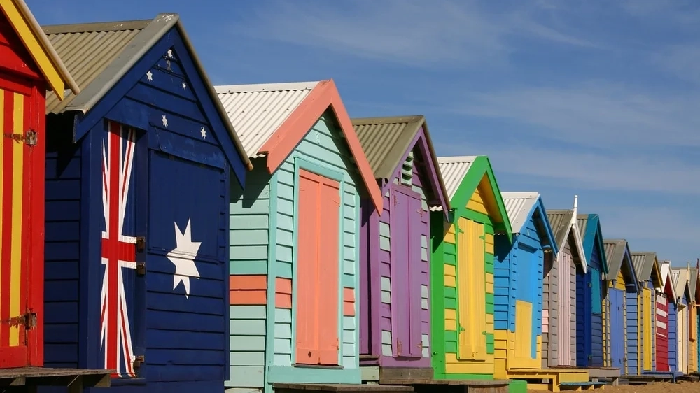 A row of brightly painted bathing boxes - an iconic vision of Brighton Beach.
