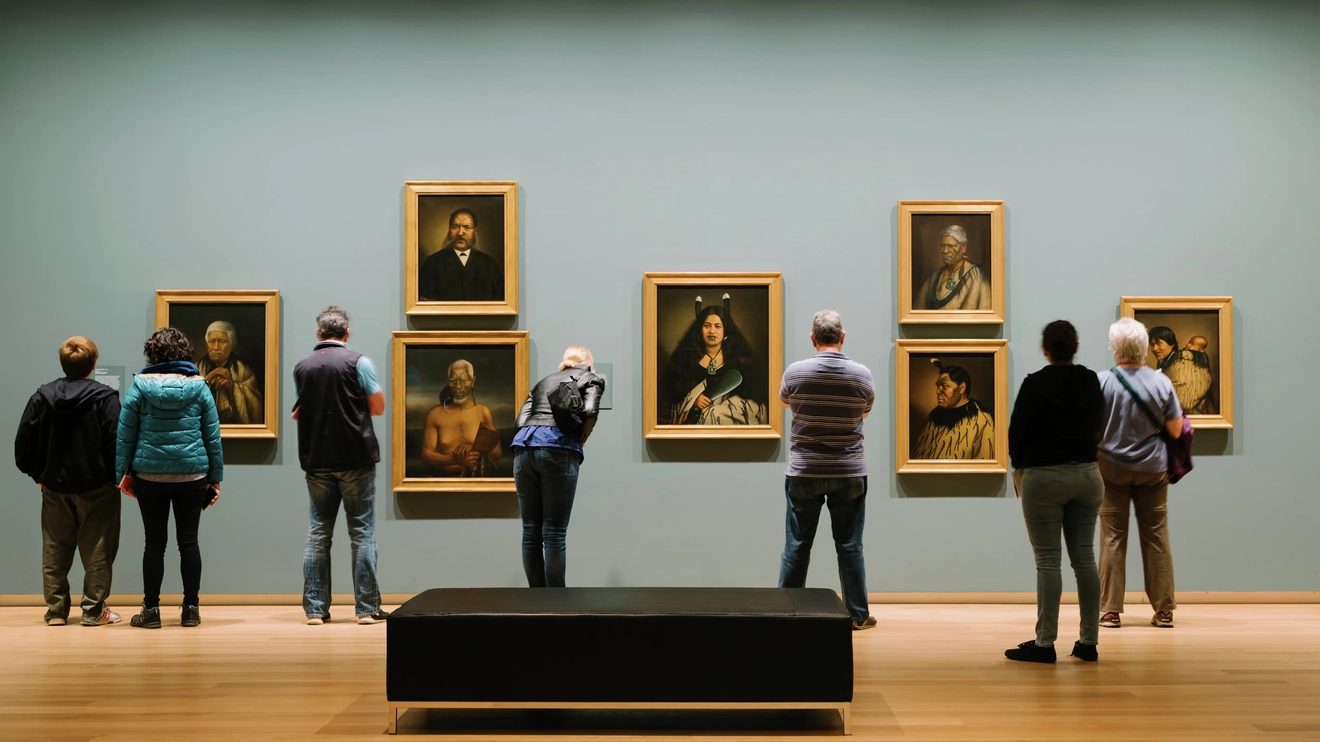 People look at paintings in Auckland Art Gallery Toi o Tāmaki. Image courtesy of Auckland Art Gallery Toi o Tāmaki