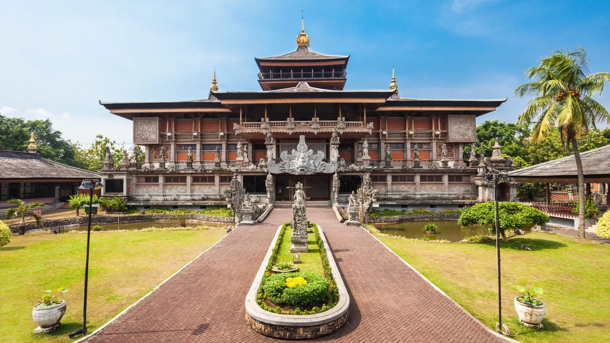 An ornate miniature building and gardens at Jakarta's Taman Mini Indonesia Indah. Image credit: stock.adobe.com