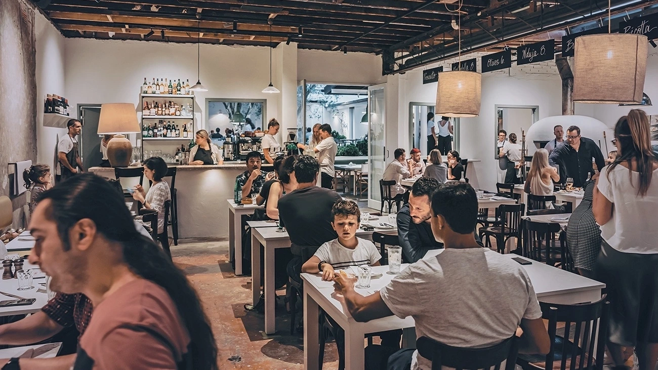 Interior of a busy Sydney restaurant with diners chatting