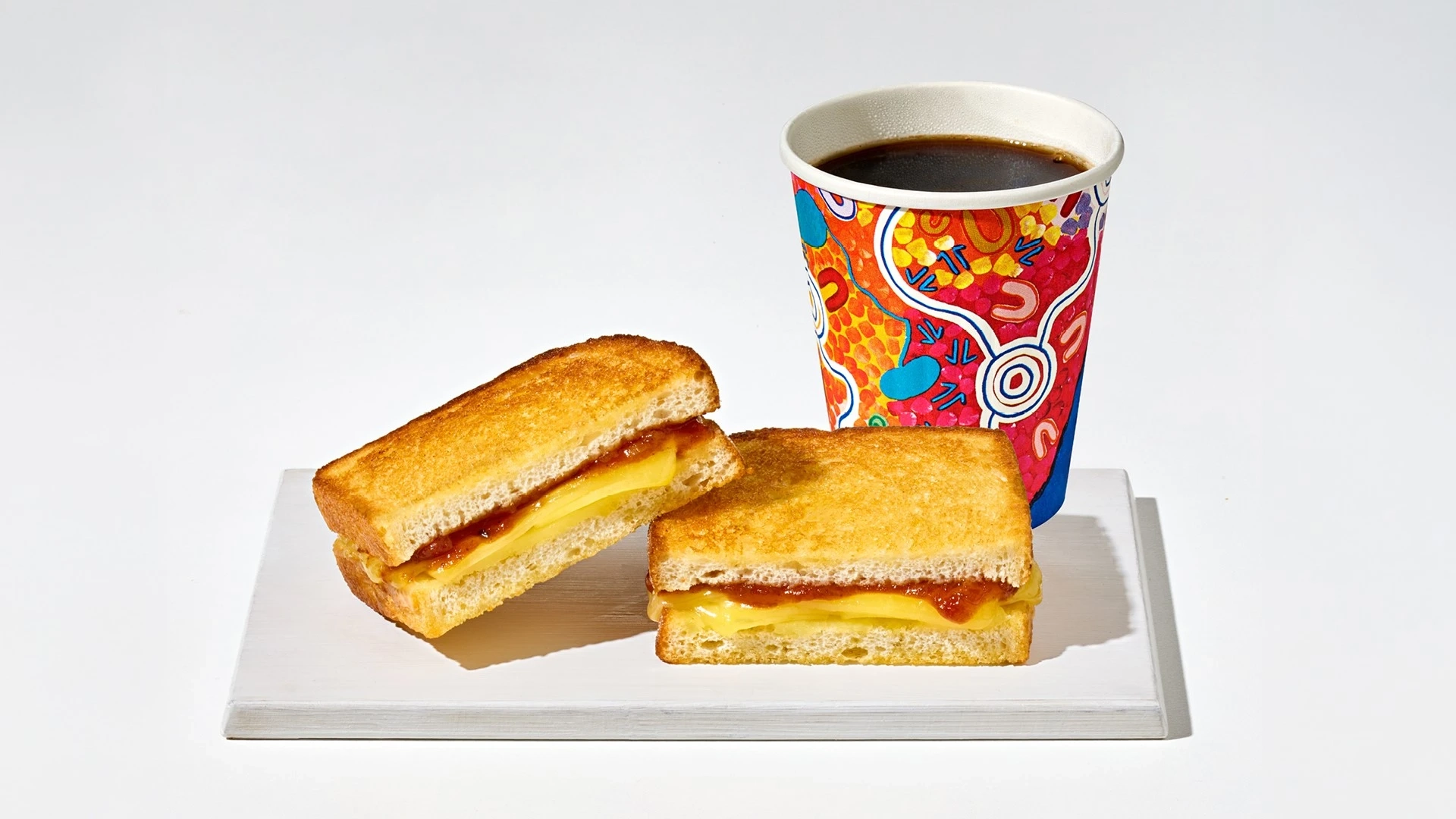 Photo of a famous Jetstar Airways cheese toastie and black coffee, served on board JQ flights.